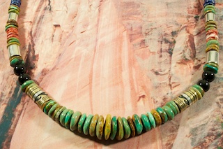 Stunning Necklace featuring Genuine Turquoise with Genuine Spiny Oyster Shell, Tiger's Eye,  Blue Lapis and Black Onyx Accents. Beautiful Gold fill and Sterling Silver Barrels, Beads and Clasp. Created by Navajo Artist Tommy Singer. Signed by the artist.